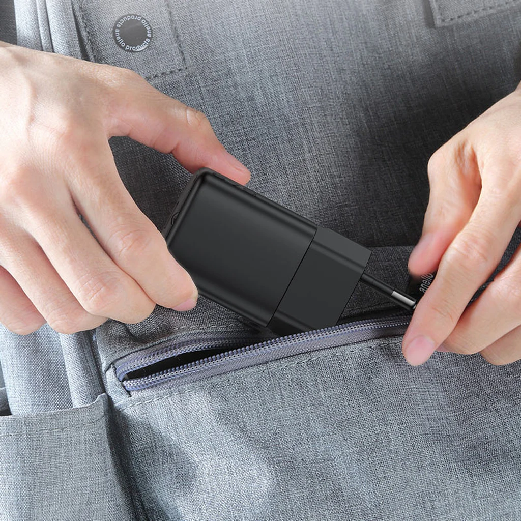 Acefast A134 67W Mini GaN charger being slipped into a backpack pocket for travel
