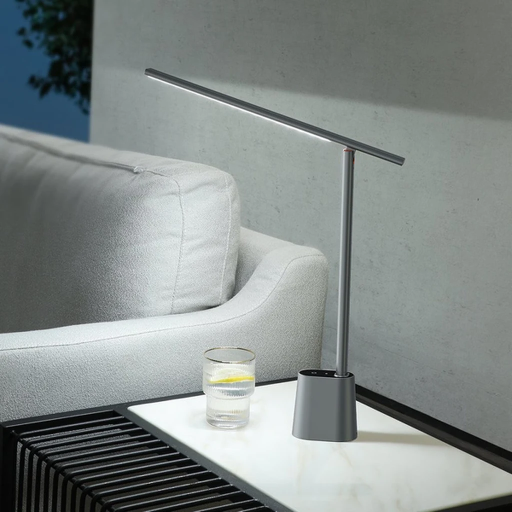 Baseus Smart Eye grey lamp on a living-room side table next to a sofa