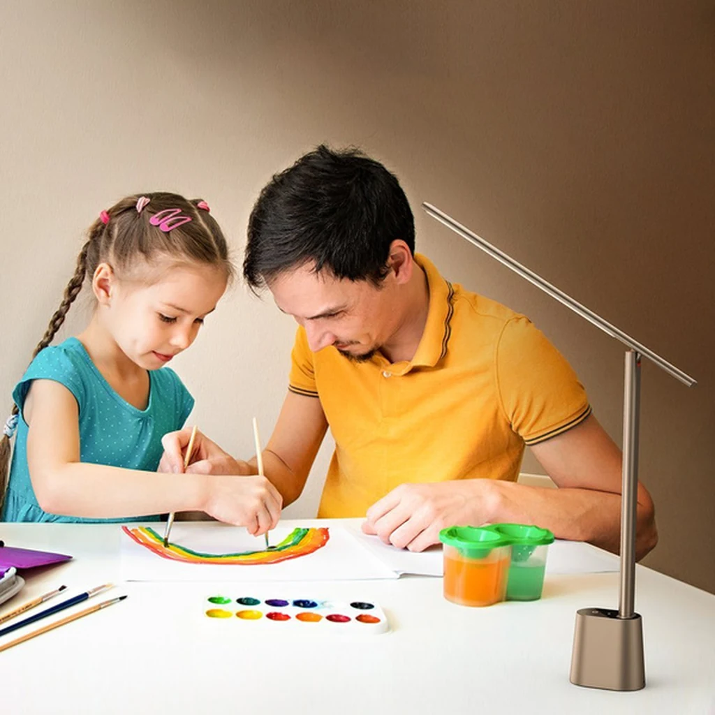 Father and daughter painting under the light of the Baseus Smart Eye grey lamp at a study table